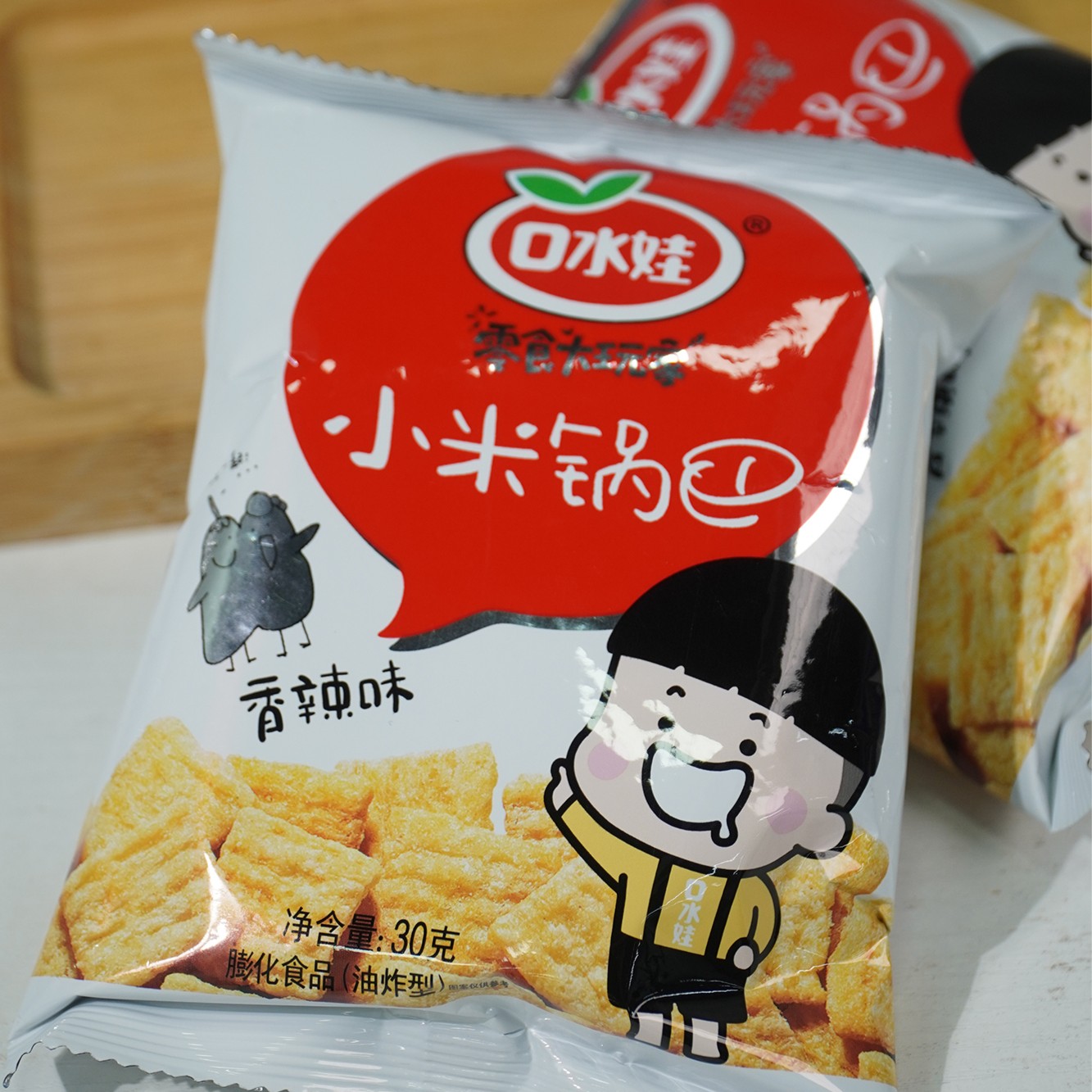 B：口水娃30克*10包小米锅巴香辣味
