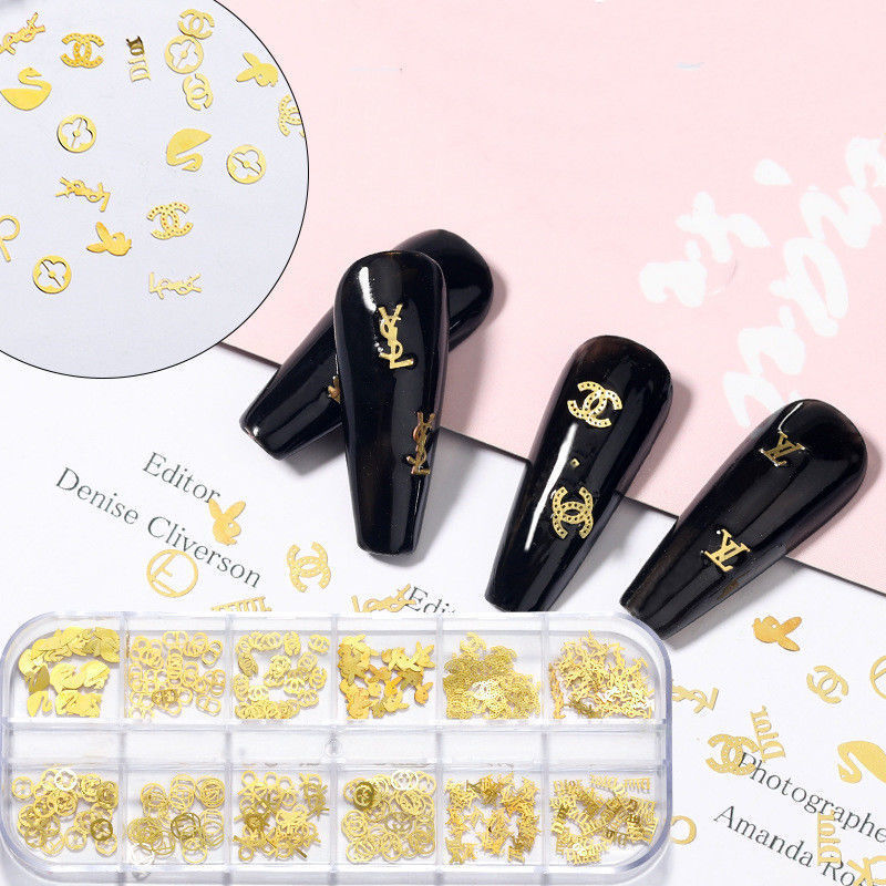 网红美甲饰品大牌logo轻奢金属镂空心形蝴蝶结四叶草铆钉贴纸混装
